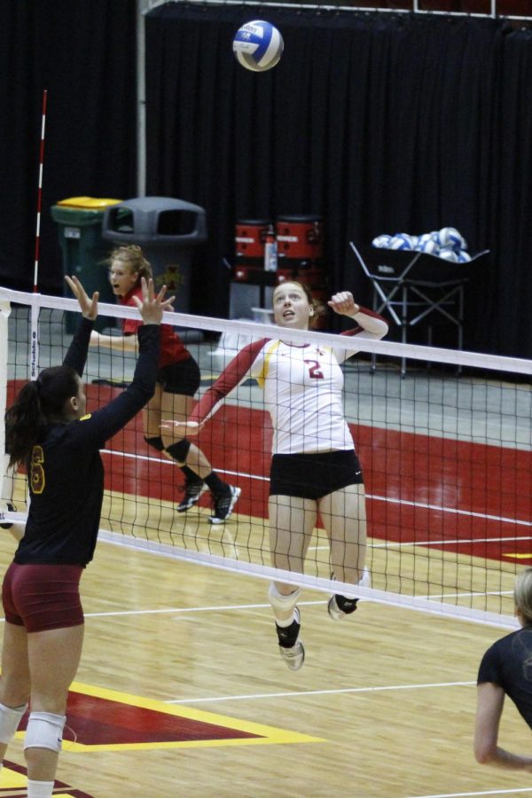 Sophomore Mackenzie Bigbee goes for the kill against Minnesota on April 13, 2013, at Hilton Coliseum.  The Cyclones fell in the final match of their spring tournament to the Golden Gophers 25-27, 26-28.
