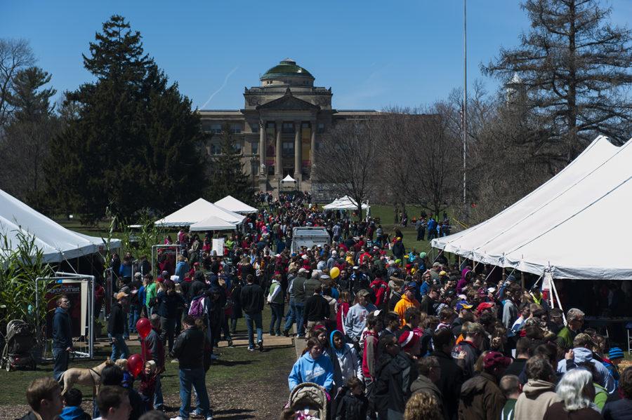 Crowds of people mill around Central Campus after the annual Veishea parade on Saturday, April 20, 2013.
