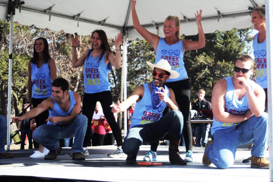 Sisters of the Chi Omega sorority and brothers of the Sigma Phi Epsilon and Sigma Alpha Epsilon fraternities perform during the roll call competition at the Greek Week kickoff on April 1, 2013.
