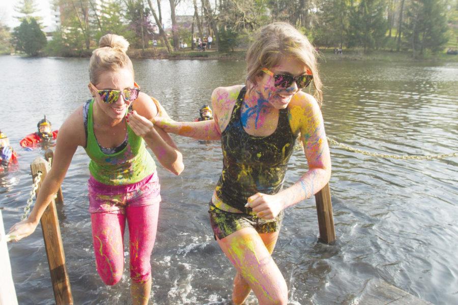 Allison Sheets, freshman in kinesiology, and Taylor Richardson, freshman in apparel, merchandising and design, run out of Lake LaVerne following their turn in Greek Weeks Polar Bear Plunge on Saturday, March 31. Polar Bear Plunge participants raise money via sponsors for Special Olympics Iowa.
