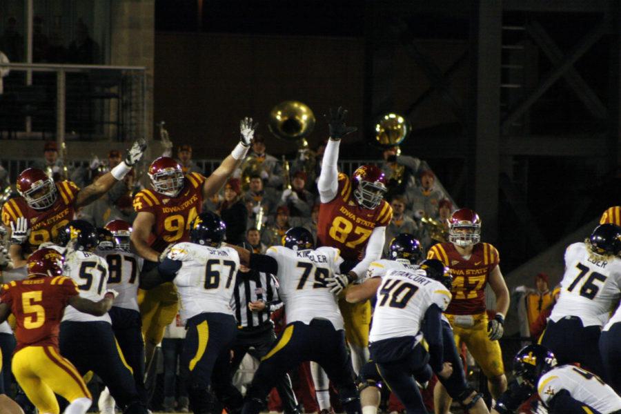 Members of the ISU football team attempt to block a West Virginia Mountaineer field goal attempt Friday, Nov. 23, at Jack Trice Stadium. The Mountaineers won the game 31-24.
