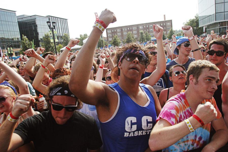Members of the crowd fist-pump along to one of Atmospheres songs at the 80/35 Music Festival in downtown Des Moines on July 7, 2012. Slug, Atmospheres lead rapper, led the crowd in chanting along to the groups music.
