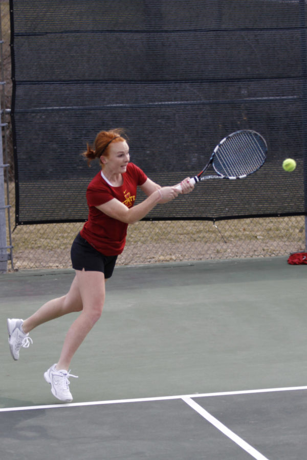 Meghan Cassens strikes the ball during double matches in Iowa States loss against Oklahoma 4-3 on Friday, April 5, 2013, at Forker Courts.
