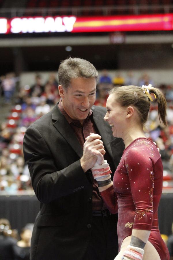 Coach Jay Ronayne celebrates with Michelle Shealy after her
9.650 performance on the bars Friday, Jan. 27, at Hilton.The
Cyclones defeated the Hawkeys 194.900-194.550 and will take on
Denver next weekend at Colorado.
