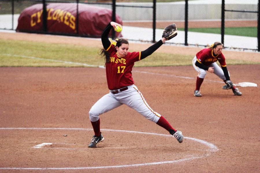 Freshman Riley Fisher pitches against Oklahoma State on Saturday, April 6, 2013. Fisher briefly took over for senior Tori Torrescano during the seventh inning.
