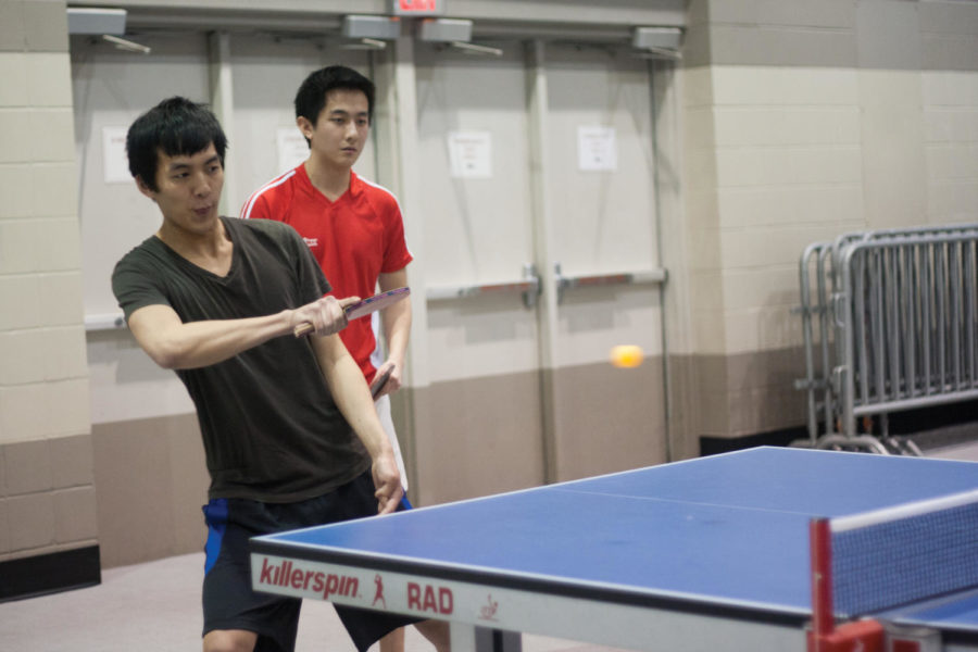 Nick Joo, senior in business economics, (left) plays in a round of ping pong with teammate Kevin Yan, senior in electrical engineering.
