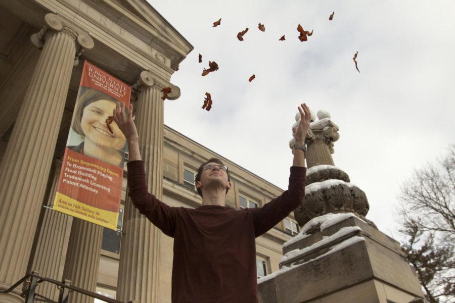 Jake Swanson, president of the Agricultural and Life Sciences Student Council, demonstrates his enthusiasm for bacon on the steps of Curtiss Hall.
