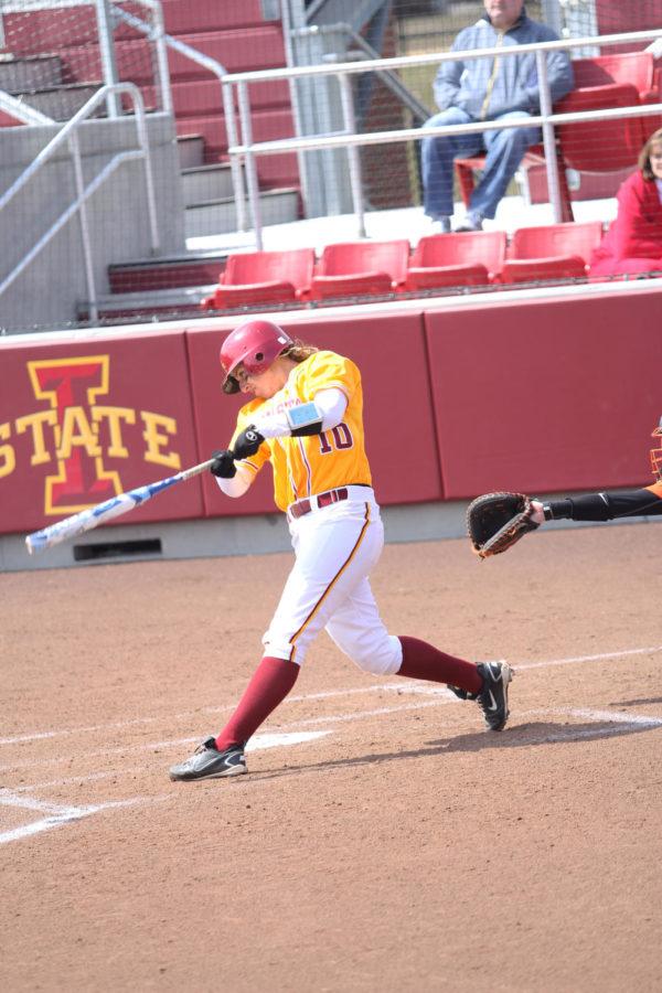 First baseman Erica Miller cranks a double for the Cyclones. The hit gained Iowa State two RBIs, giving the Cyclones a start at taking the lead. The ISU softball team took on Oklahoma State on Sunday, April 7, 2013,wrapping up a weekend-long tournament. The Cyclones won after a game of 6-and-a-half innings with a final score of 9-7.
