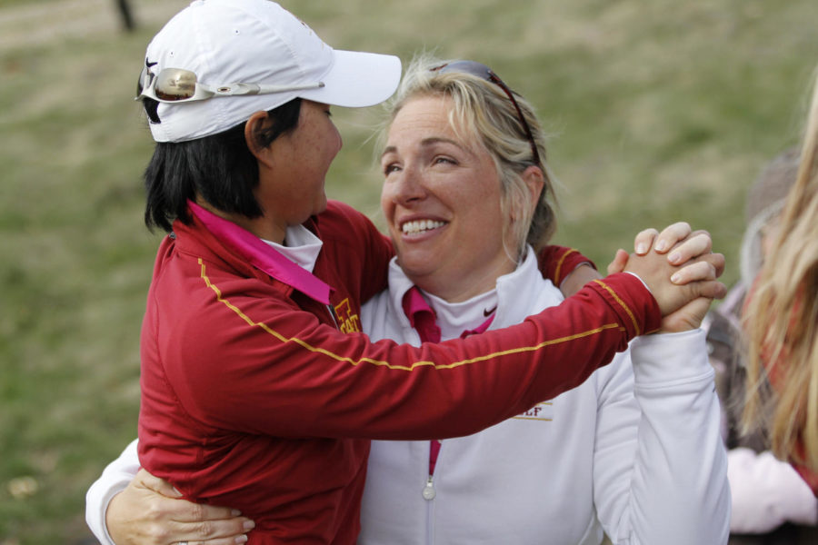 Punpaka Phuntumabamrung gets a hug and congratulations from head coach Christie Martens at the end of the second round of the 2013 Big 12 Womens Golf Championship at the Harvester on April 20, 2013, in Rhodes, Iowa.
