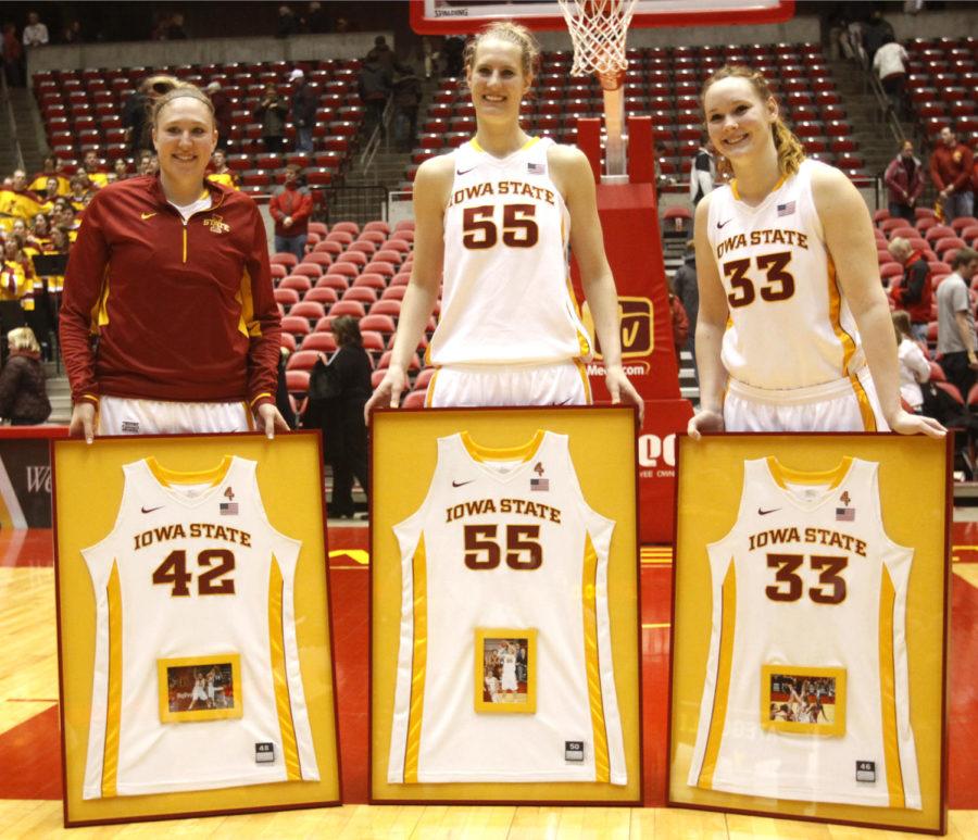 Amanda Zimmerman, Anna Prins and Chelsea Poppens pose with their jersey numbers during senior night on March 4, 2013, at Hilton Coliseum.

