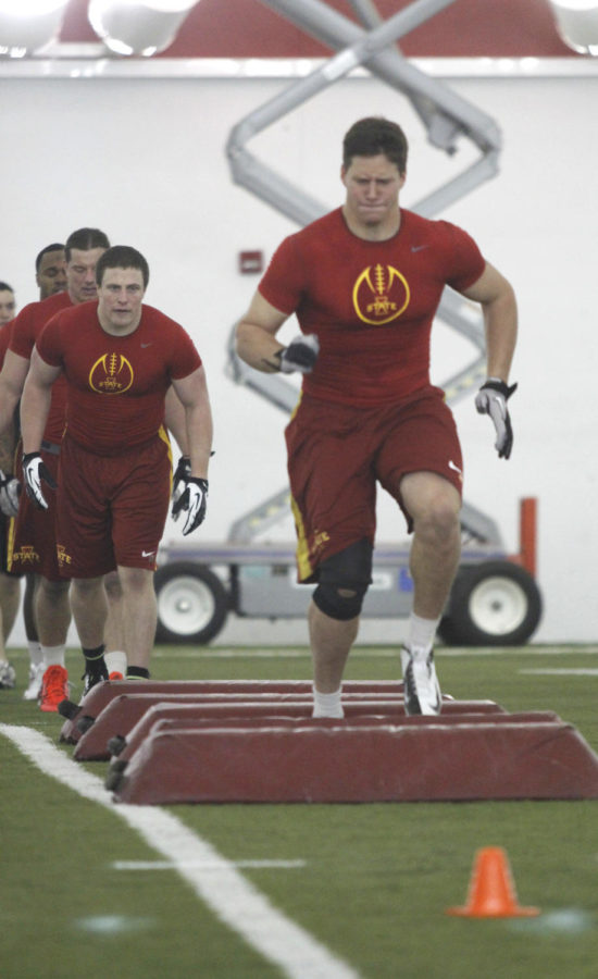 Former linebacker A.J. Klein participates in a drill that was lead by a scout as Jake Knott gets ready to follow Klein during Pro Day at the Bergstrom Facility on Tuesday, March 26, 2013.
