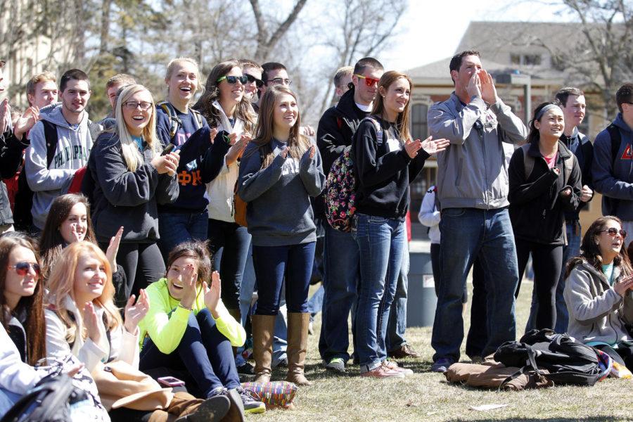 The crowd cheers and claps for the fraternities and sororities after they perform a song during the first round of the Greek Week karaoke tryouts on April 2, 2013 on Central Campus.
