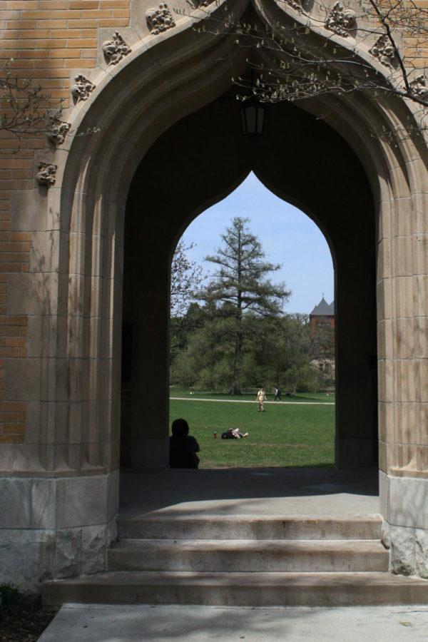 The Campanile provides shade for a student.
