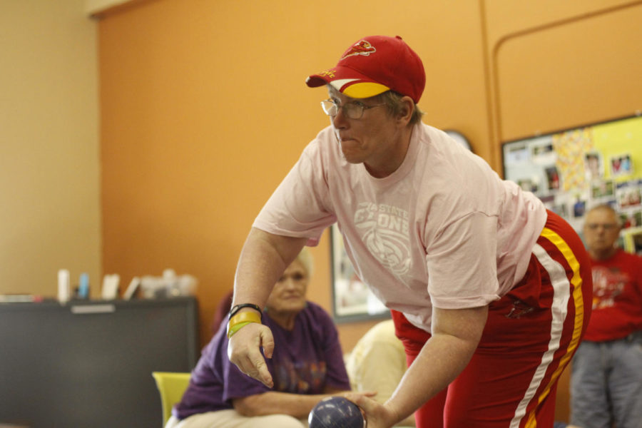 Special Olympics athlete Kim Lively practices bocce ball at the Mainstream Living Center on May 20, 2013