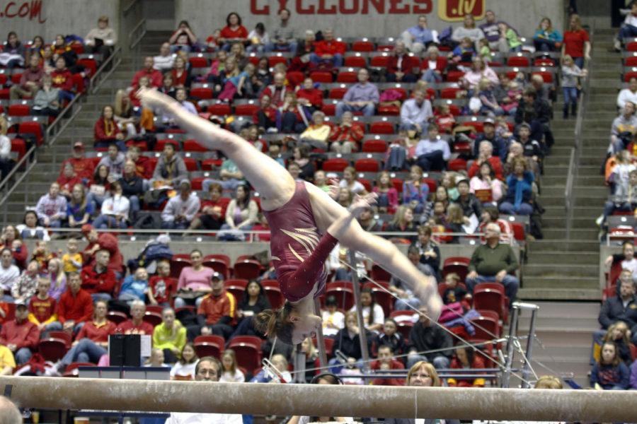 Michelle Shealy does a backward flip during her beam performance  Feb. 15 at the Hilton Coliseum. Shaely scored 9.875 on beam and won the Mari-Rae Sopper Award.
