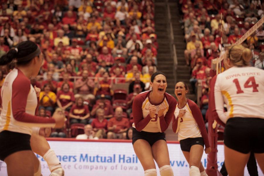 Players celebrate after a point during the game against Nebraska on Saturday, Sept. 15, at Hilton Coliseum. Cyclones won 3-1, which is the first time Cyclone volleyball team has defeated a No. 1 team in school history. 
