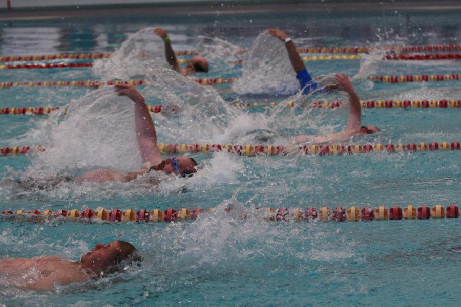 Competitors in the mens backstroke make their way across the Beyer pool in the Special Olympics swimming competition on Friday, May 24, 2013.
