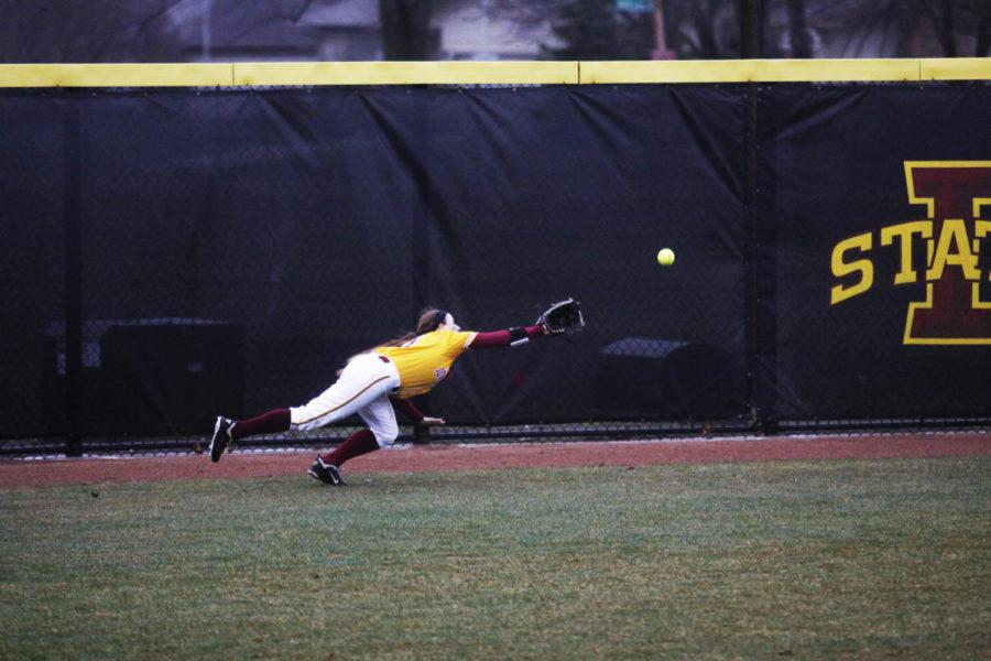 Sophomore left-field Jorden Spendlove dives to catch a ball hit by a Drake batter on April 9, 2013. The Cyclones defeated the Bulldogs 6-5.

