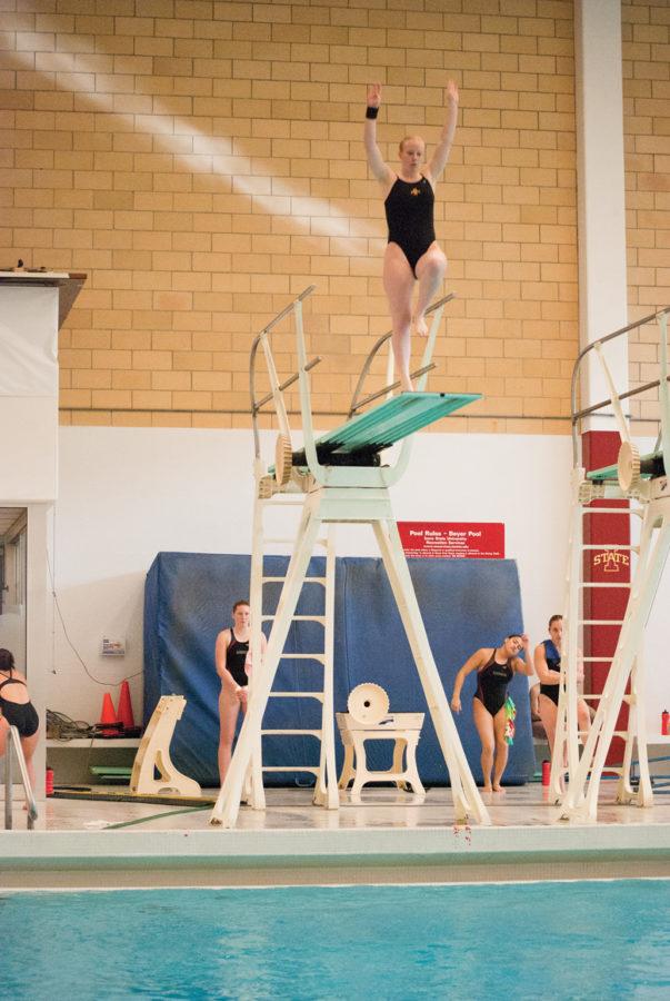 Abby Christensen dives into the pool at Beyer Hall on Saturday, Jan. 29 in a meet against Nebraska.