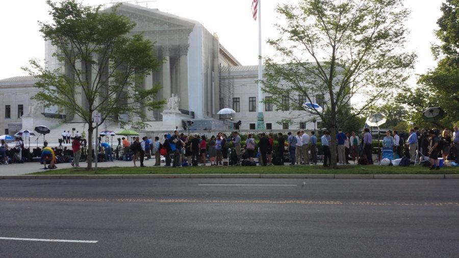 People line up outside the Supreme Court in Washington, demonstrating and awaiting the courts decision on DOMA and Prop 8. This is what the line looked like around 6:15 a.m. CST.