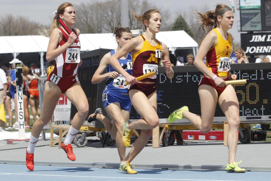 Senior Dani Stack runs her leg during the womens distance medley at the Drake Relays on April 27, 2013, at Drake Stadium. Moments after, Stack was passed by Minnesota and finished in third with a time of 11:12.92.
