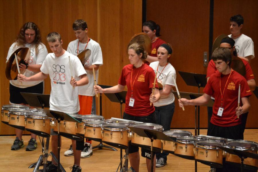Drumline+students+from+the+Yamaha+Sounds+of+Summer+Marching+Percussion+Clinic+show+off+their+new+skills+at+a+free+concert+in+the+Martha-Ellen+Tye+Recital+Hall+on+June+9%2C+2013.