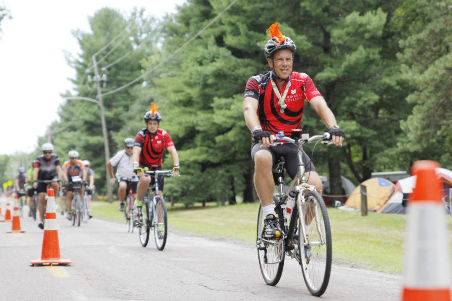 Bikers ride into the campgrounds at the Des Moines location of RAGBRAI at Water Works Park on July 23, 2013.