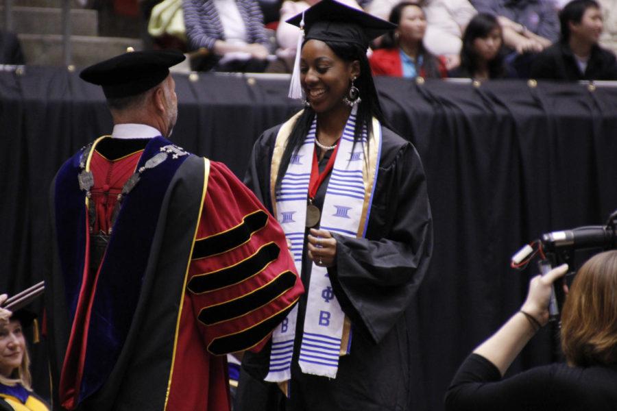 Graduate Tia Mays receives her degree from President Steven Leath on May 11, 2013.

