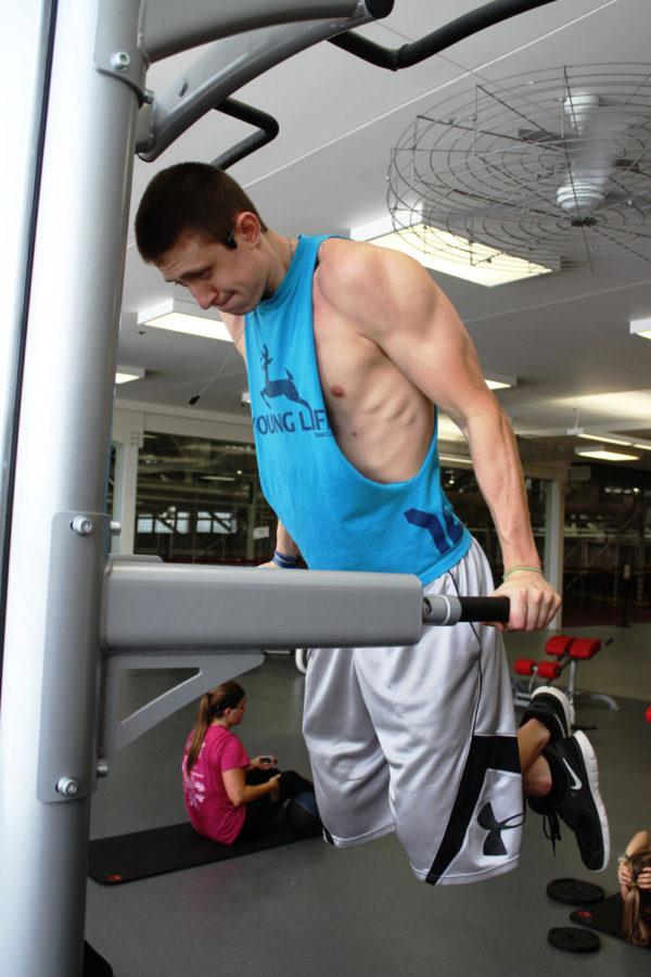 Freshman Alex Peterson, a construction engineering major, works out at Lied Recreation Center on Friday, August 23rd, 2013. 