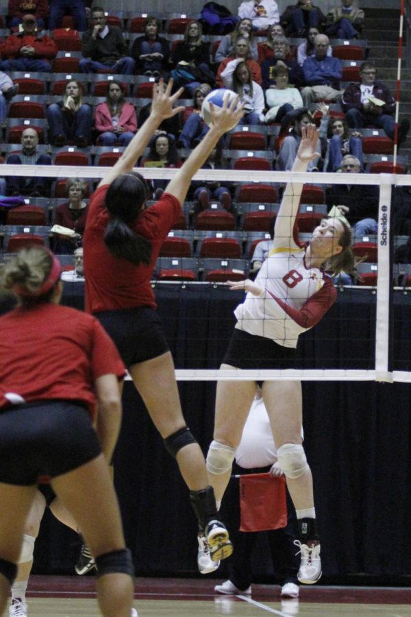Sophomore Andie Malloy goes for the spike against the University of Nebraska-Omaha on April 13, 2013, at Hilton Coliseum.  The Cyclones won their first match 25-15, 25-14, 15-8.
