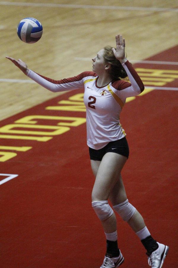 Sophomore Mackenzie Bigbee serves the ball against Northern Iowa on April 13, 2013, at Hilton Coliseum.  The Cyclones won their second match of their spring tournament 28-26, 25-17, 15-5.
