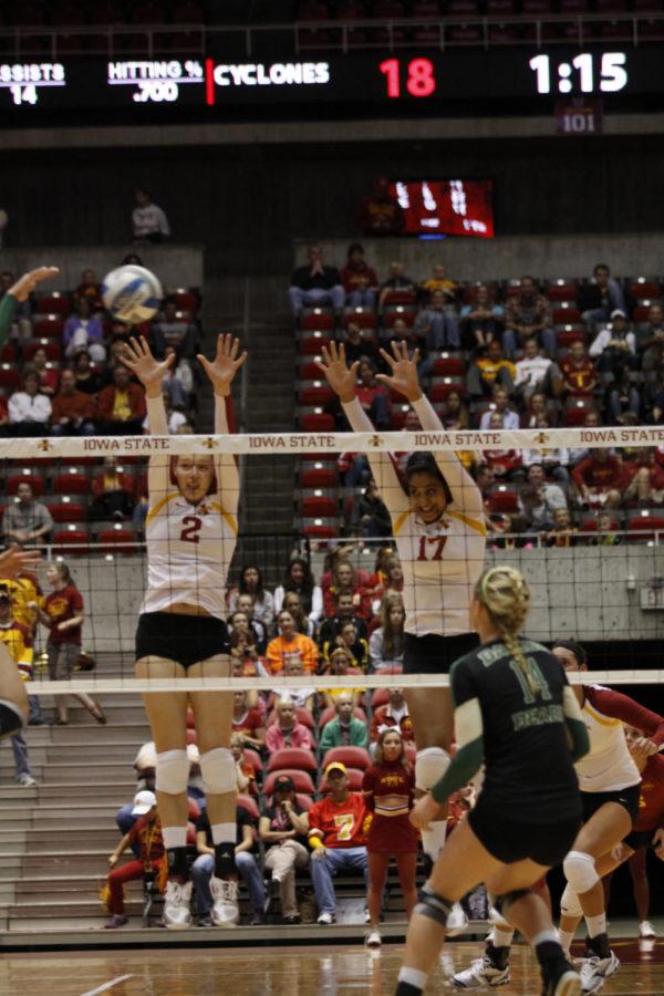 Mackenzie Bigbee and Tenisha Matlock jump for a block during the game against Baylor on Saturday, Sept. 22, at Hilton Coliseum. Cyclones won the match 3-1.
