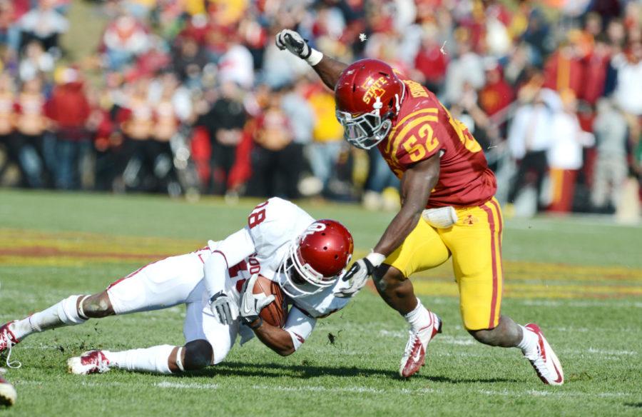 Jeremiah George attempts to tackle an OU player at the game on Saturday, Nov.3, 2012 at Jack Trice Stadium. George had a total of 13 solo tackles in the 35-20 loss to the Oklahoma Sooners. 
