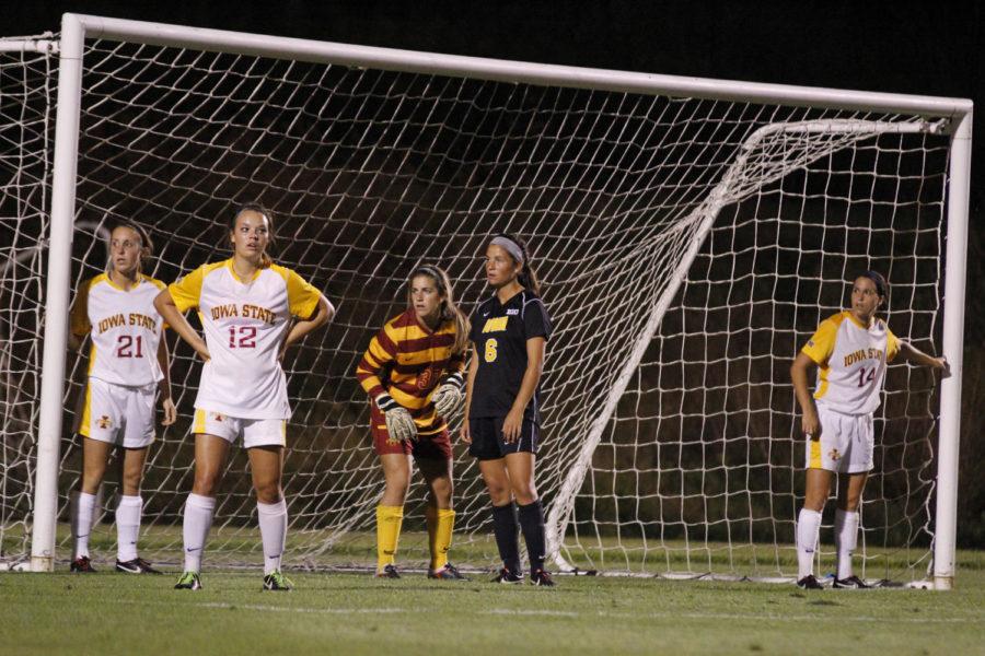 No. 21 Adalie Schmidt, No. 12 Madi Ott, No. 32 goalie Maddie Jobe and No. 14 Meredith Skitt prepare to defend a corner kick late in the game during Iowa States 3-0 loss to Iowa on Sept. 6, 2013, at the Iowa Soccer Complex in Iowa City.