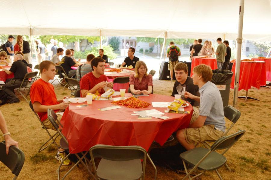 From left, Grady Jensen, Jacob Ellis, Laura Hocraffer, Cole Cummings and Paul Leichty enjoy lunch at the Union Pacific event under the Marston Water Tower in front of Hoover Hall on Thursday, Sept. 12.