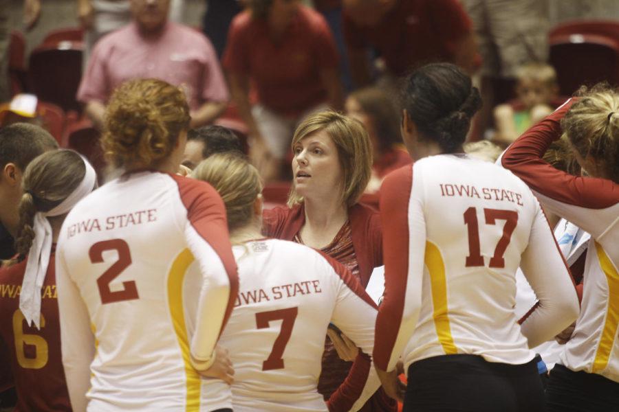 Head coach Christy Johnson-Lynch gives the team a pep talk after the first set. Iowa State finished the game with a total of 34 kills and six service aces.