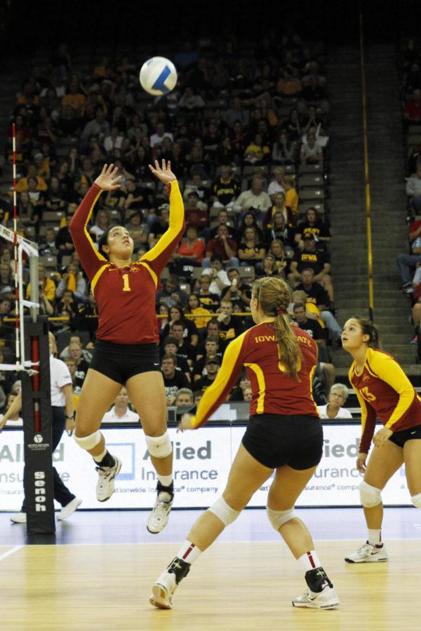 Sophomore Jenelle Hudson sets the ball during the rivalry game against Iowa on Sept. 21, 2013, at Carver-Hawkeye Arena. Hudson recorded 44 assists in the 25-11, 27-29, 25-23, 25-20 victory.