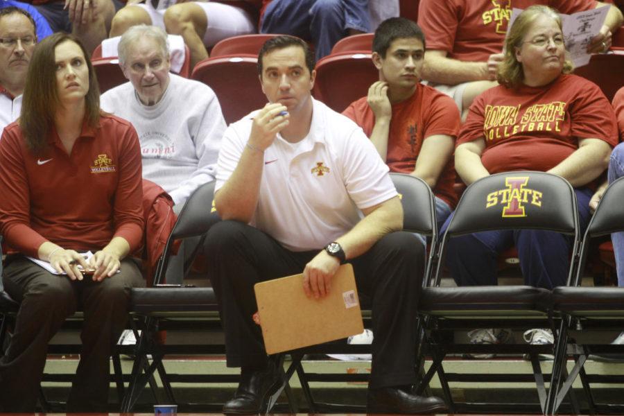 Jon Newman-Gonchar, assistant volleyball coach, watches from the bench as the Cyclones fight to win each point in the third set. They came out on top with a final score of 30-28 against San Diego on Friday, Sept. 6, at Hilton Coliseum.