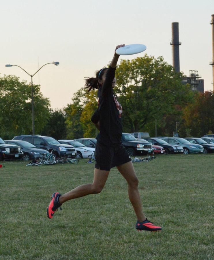 Ultimate Frisbee co-captain Janani Ragothaman, junior in chemical engineering, gets some air and catches a pass.