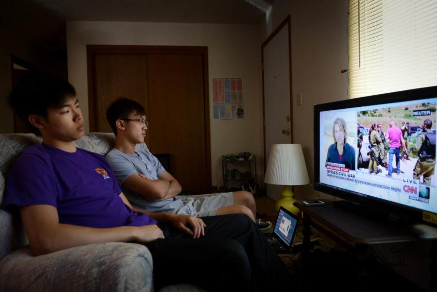 Iowa State Students Zi Lang Wong and Christopher Phoon watch coverage of the war in Syria on the news every day. 