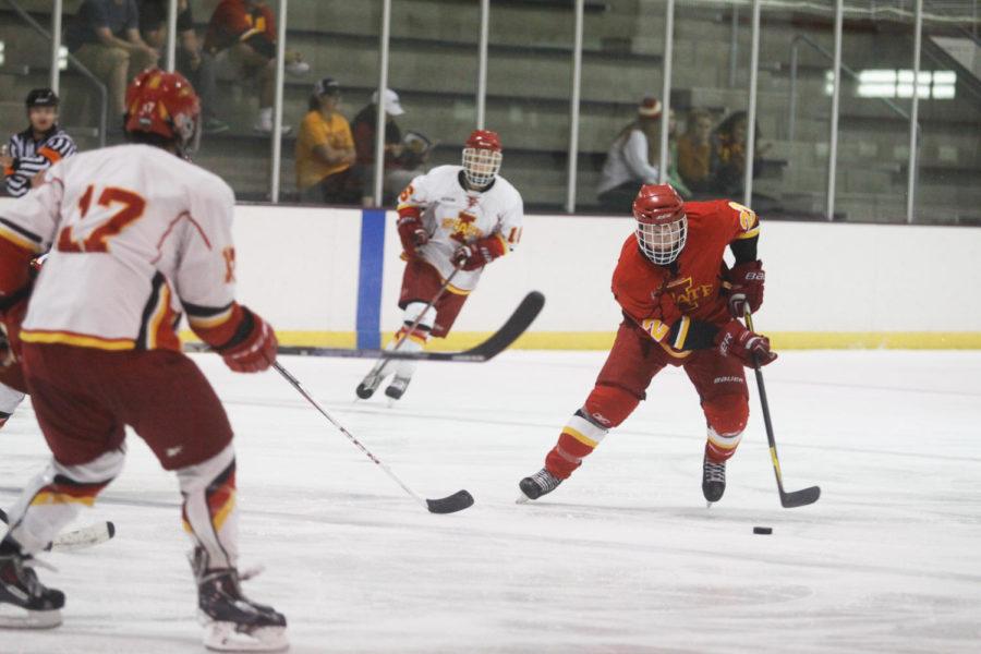 Senior+Kean+Ludvicek+brings+the+puck+down+the+rink+during+the+scrimmage+on+Sept.+11+2013+at+Ames%2FISU+Ice+Arena.