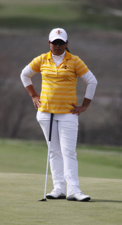 Sasikarn On-iam, a junior in Pre Liberal Studies, patiently watches as her opponent takes her turn at the Big 12 Golf Tournament on Sunday, April 21 at The Harvester.
