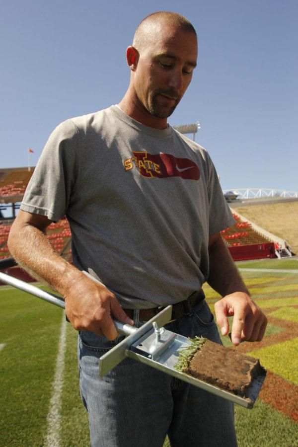 Tim Van Loo, the manager of athletic turf, shows the different levels of the turf on the field at Jack Trice Stadium. One of the biggest challenges of the turf is cold fall weather.