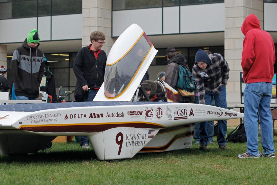 Todd Wegter, senior in computer engineering, sits within the PrISUm solar car, which was on display during Sustainability Day in front of Parks Library on Wednesday, Oct. 23. The car, built by Team PrISUm, placed third at this years American Solar Challenge Formula Sun Grand Prix race.