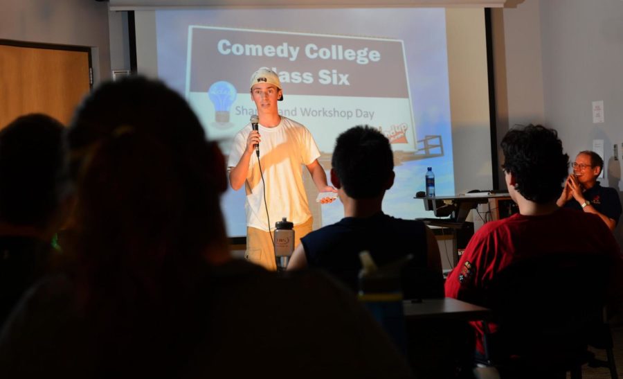 Eric Lacey, junior in mechanical engineering, doing standup for his Comedy College final performance .