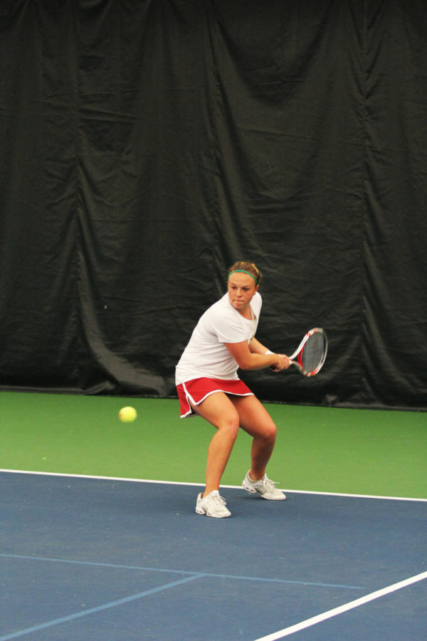 Sophomore Ksenia Pronina returns the ball against West Virginia on Sunday, April 14, 2013, at Ames Racquet and Fitness.
