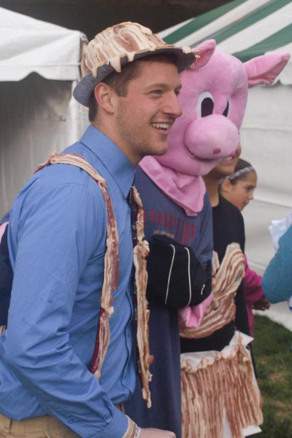 An Iowa State Student shows off his bacon outfit after the fashion show at Bacon Expo on October 19.