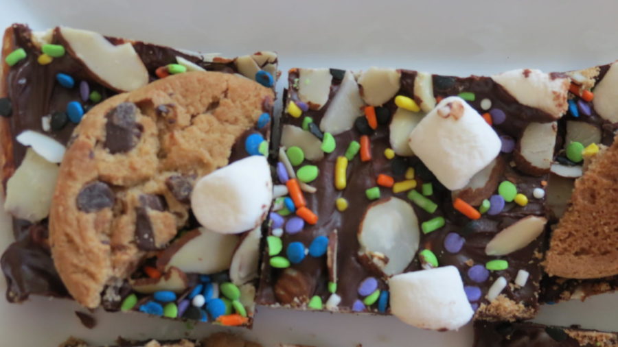 Making chocolate bars is a new and easy way to use up your leftover Halloween candy. These bars can be made with all types of ingredients that are lying around the house. 