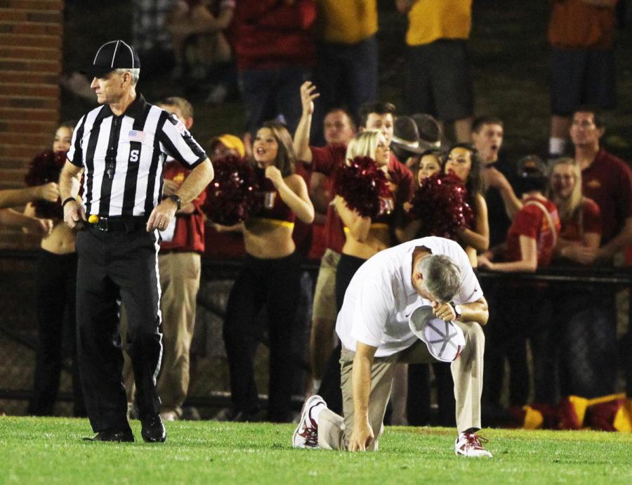 Coach Paul Rhoads drops down in reaction to a would-be fumble from Texas in the fourth quarter. The Cyclones lost 31-30 to the Longhorns on Oct. 3, 2013, at Jack Trice Stadium.