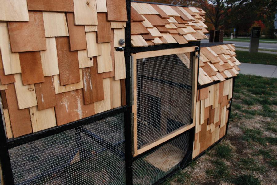 A collection of unorthodox chicken coops built by architecture students stand outside the College of Design. The coops were built to house three to five chickens and will remain standing until Oct. 25.
